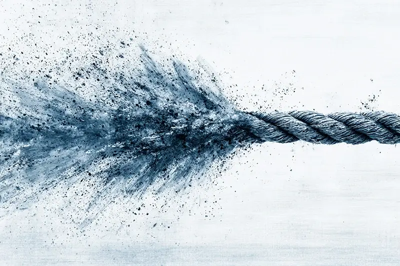 A tug of war rope suddenly released by one side